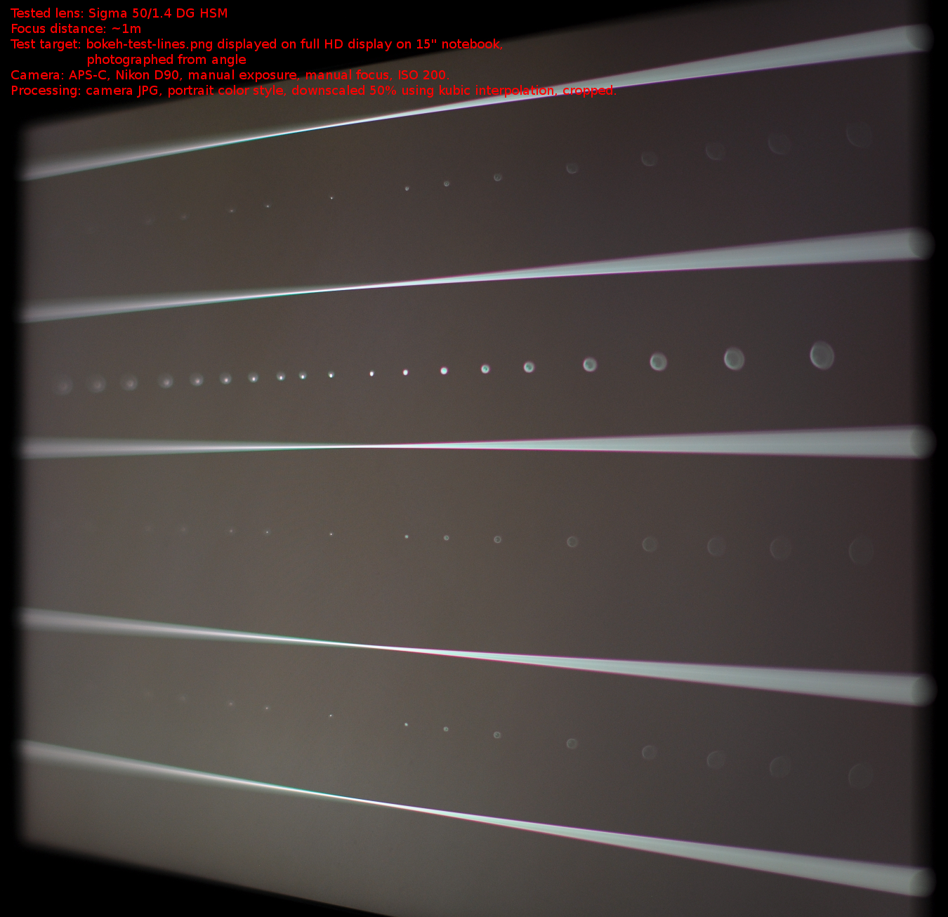 real bokeh sample of lens with under-corrected spherical abberation on bokeh-test-lines.png target